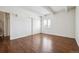Bedroom featuring hardwood flooring, large closet, and natural light at 384 S Ironton St # 413, Aurora, CO 80012