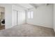 Bedroom with closet and window with blinds overlooking property at 384 S Ironton St # 413, Aurora, CO 80012