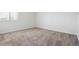 Carpeted bedroom with a window offering natural light at 384 S Ironton St # 413, Aurora, CO 80012