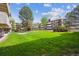 Well-manicured lawn with landscaping and apartment buildings in the background at 384 S Ironton St # 413, Aurora, CO 80012