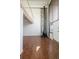 Bright living room with a stone accent wall, wood floors, a fireplace, and lots of natural light at 384 S Ironton St # 413, Aurora, CO 80012