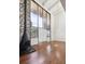 Bright living room with a stone accent wall, wood floors, a fireplace, and lots of natural light at 384 S Ironton St # 413, Aurora, CO 80012