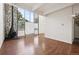Living room with a stone fireplace, wood floors and large windows at 384 S Ironton St # 413, Aurora, CO 80012