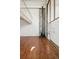Bright living room with a stone accent wall, wood floors, a fireplace, and lots of natural light at 384 S Ironton St # 413, Aurora, CO 80012