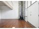 Bright living room with a stone accent wall, wood floors, a fireplace, and lots of natural light at 384 S Ironton St # 413, Aurora, CO 80012