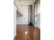 Bright living room with a stone accent wall, wood floors, a fireplace, and lots of natural light at 384 S Ironton St # 413, Aurora, CO 80012
