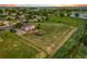 Expansive backyard with play area in this serene, aerial view property overlooking the pond at 17635 Silver Fox Ct, Mead, CO 80542