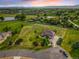 Picturesque aerial view of the property with mature landscaping and serene water feature at 17635 Silver Fox Ct, Mead, CO 80542