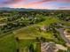 Stunning aerial view of the home surrounded by expansive green space and mountain views at 17635 Silver Fox Ct, Mead, CO 80542