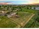 Aerial view showcasing the large yard, neighborhood pond, and green space at 17635 Silver Fox Ct, Mead, CO 80542