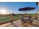 Deck perfect for outdoor dining featuring a table, chairs and a golf course view at 17635 Silver Fox Ct, Mead, CO 80542