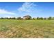 View of the expansive yard, showcasing potential for outdoor activities, play set, and landscaping at 17635 Silver Fox Ct, Mead, CO 80542