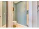 Clean bathroom with beige tiled floor and minimalist toilet and cabinet at 17635 Silver Fox Ct, Mead, CO 80542