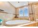 Soaking tub and shutters with shower at 17635 Silver Fox Ct, Mead, CO 80542