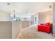 Bright bonus room with plush carpet and chandelier at 17635 Silver Fox Ct, Mead, CO 80542