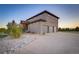Contemporary home with a three-car garage and a long driveway at 17635 Silver Fox Ct, Mead, CO 80542