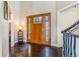 Bright foyer with a decorative front door, tile floor, and open floor plan at 17635 Silver Fox Ct, Mead, CO 80542