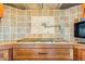 Custom kitchen with a tile backsplash, stainless oven, and wood drawers at 17635 Silver Fox Ct, Mead, CO 80542