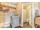 Functional laundry room with front load washer, dryer, and nearby bathroom at 17635 Silver Fox Ct, Mead, CO 80542