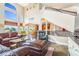 Spacious living room with soaring ceilings, large windows, and open access to other living areas at 17635 Silver Fox Ct, Mead, CO 80542