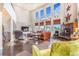 Bright living room with tall ceilings, large windows, fireplace, and comfortable seating at 17635 Silver Fox Ct, Mead, CO 80542