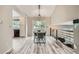 Bright dining room featuring hardwood floors, and staircase access at 11481 King St, Westminster, CO 80031