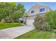 Charming two-story home featuring stone accents, a two-car garage, and a well-maintained front yard at 11481 King St, Westminster, CO 80031