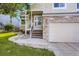 Charming home exterior with stone accents, well-kept lawn, and inviting front entrance at 11481 King St, Westminster, CO 80031