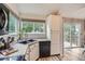 Charming kitchen features a black sink, modern appliances, and natural light from the window at 11481 King St, Westminster, CO 80031