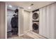 Convenient laundry area with stacked washer and dryer, plus closet for extra storage space at 11481 King St, Westminster, CO 80031