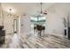 Bright living room featuring vaulted ceilings, hardwood floors, and large windows for natural light at 11481 King St, Westminster, CO 80031