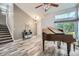 Bright living room featuring vaulted ceilings, hardwood floors, and staircase access at 11481 King St, Westminster, CO 80031