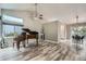 Bright living room featuring hardwood floors, and access to dining room at 11481 King St, Westminster, CO 80031