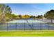 A fenced outdoor tennis court offers residents an athletic activity in a community setting at 11481 King St, Westminster, CO 80031