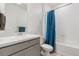 Bathroom with tub shower combination and gray vanity at 39 N Waterloo St, Aurora, CO 80018