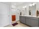 Modern bathroom with double vanity and walk-in shower at 39 N Waterloo St, Aurora, CO 80018