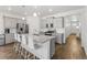 Modern kitchen with gray cabinets, granite countertops, and an island at 39 N Waterloo St, Aurora, CO 80018