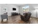 Relaxing living room with hardwood floors and a large window at 39 N Waterloo St, Aurora, CO 80018