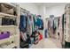 Large walk-in closet with shelving and hanging rods at 39 N Waterloo St, Aurora, CO 80018