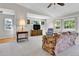 Bright living room featuring large windows, comfortable seating, and neutral decor at 9177 W Cedar Dr # D, Lakewood, CO 80226