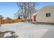 Backyard features a privacy fence and red back door at 2280 W Center Ave, Denver, CO 80223