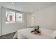 Bright bedroom with a view of the exterior, featuring neutral décor and natural light at 2280 W Center Ave, Denver, CO 80223