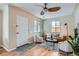 Bright living room with hardwood floors, ceiling fan, and ample natural light at 2280 W Center Ave, Denver, CO 80223