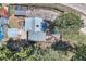 Overhead aerial view of a beautiful home showing the yard, parking area, and wooded surroundings at 27389 Highway 74, Evergreen, CO 80439