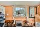 Cozy bedroom featuring a mountain view, a decor deer, wooden walls, and comfortable furnishings at 27389 Highway 74, Evergreen, CO 80439