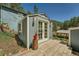 Exterior of the outbuilding with a small deck and view of the surrounding landscape at 27389 Highway 74, Evergreen, CO 80439