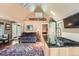 Bright living area with a kitchen island, comfortable seating, and rustic decorative ski accents at 27389 Highway 74, Evergreen, CO 80439