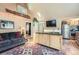Bright open living space with kitchen island, comfortable seating, and decorative ski accents at 27389 Highway 74, Evergreen, CO 80439