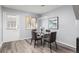 Charming dining room featuring a glass table, modern lighting, and a window with natural light at 3423 Madison Ave # X133, Boulder, CO 80303