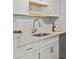 Close-up of a kitchen sink with white countertops and modern fixtures at 3423 Madison Ave # X133, Boulder, CO 80303